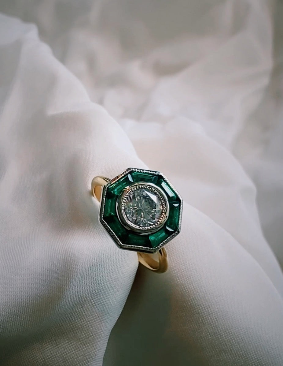 Custom Ring with Octagonal Emerald Traps and a Round Brilliant Diamond - Always Coco Fine