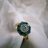 Custom Ring with Octagonal Emerald Traps and a Round Brilliant Diamond